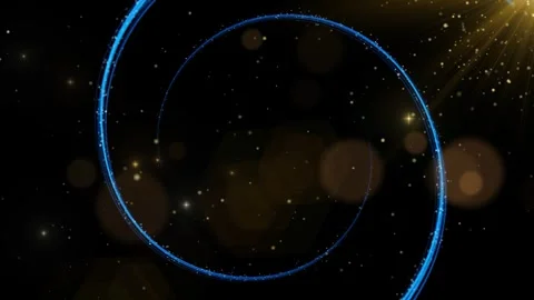 Blue glowing swirling light trails with floating golden particles against dark Stock Footage 344310700