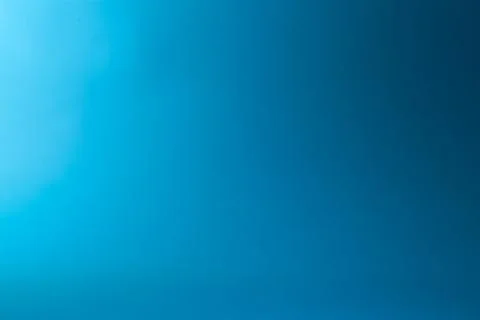 Blue gradient background with some smooth lines in it and some light effects Stock Photos