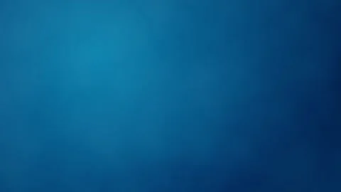 Blue gradient blurred background with noise, smoothly moving in green hues. The Stock Footage 289013374