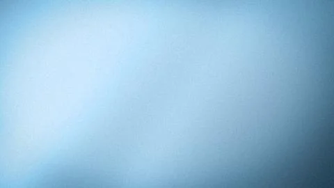 Blue gradient of light and dark shades with grainy textured background in 4.. Stock Photos