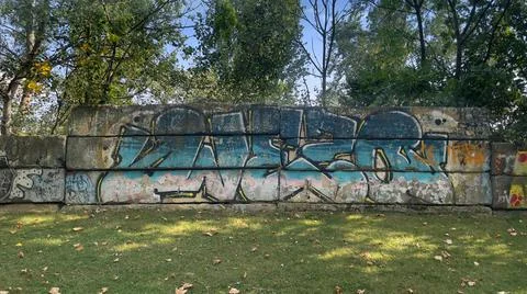 Blue graffiti text on a wall Stock Photos