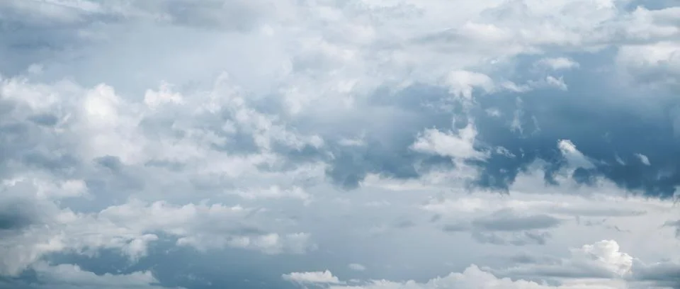 Blue gray clouds background, dramatic sky, beautiful cloudscape, wide banner 写真素材