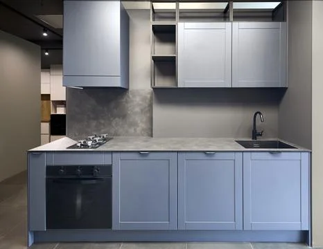 Blue gray contemporary kitchen linearlayout with hood, two burners gas cooker Stock Photos