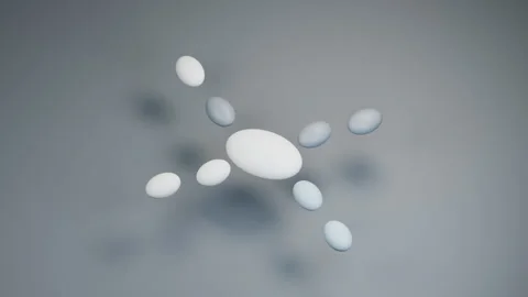 Blue Gray Pebbles Orbiting a Central White Stone 库存影片 348045713