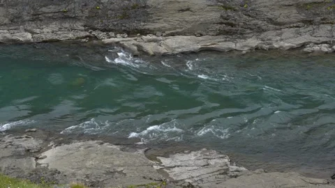 Blue-Green River Flowing Through a Rugged Rocky Canyon in Iceland Video stock 339874915