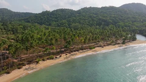 Blue-green waters hug the empty curve of Wai Chaek Beach, Thailand Stock Footage 310266928
