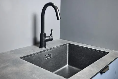 Blue grey contemporary kitchen linearlayout with hood two burners gas cooker hob Stock Photos