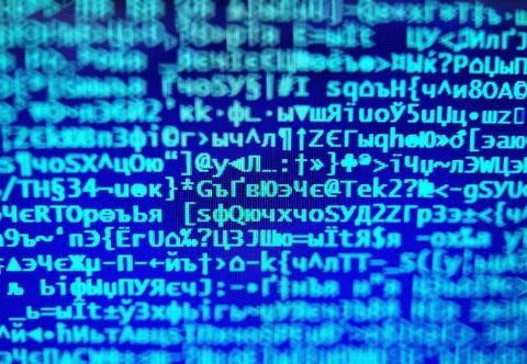 Blue hacker code on display console bokeh backdrop Stock Photos