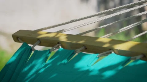 Blue hammock swinging slow motion Stock Footage 106811206