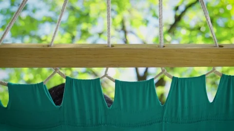 Blue hammock swinging slow motion Stock Footage 106812098
