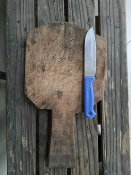 A blue-handled stainless knife Stock Photos