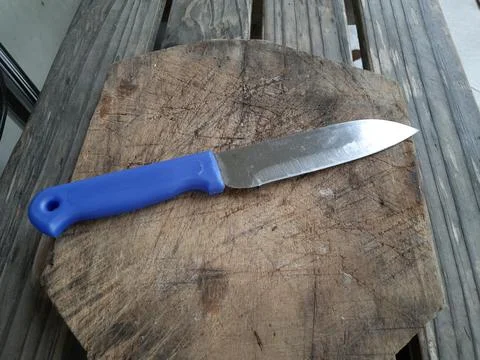 A blue-handled stainless knife Stock Photos