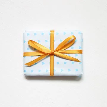 Blue heart shape pattern gift box isolated on white background Stock Photos