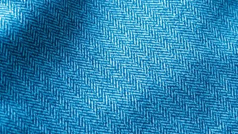 Blue herringbone fabric texture close up Stock Photos