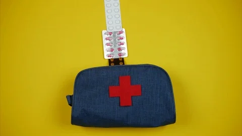 Blue home first aid kit filled with pills. Stop motion Video stock 100974547
