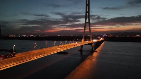 Blue hour aerial view of illuminated Yangtze bridge in Nanjing China Stock Footage 337885280