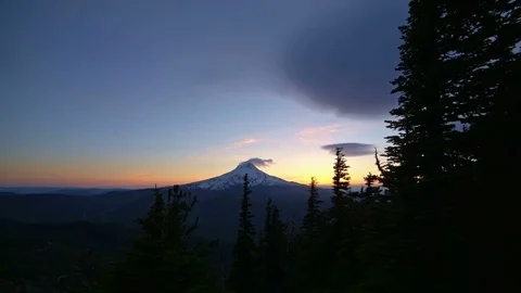 Blue hour dusk summit of Mt. Hood and blowing snow snowcapped snowy peak and Stock-Footage 81597296