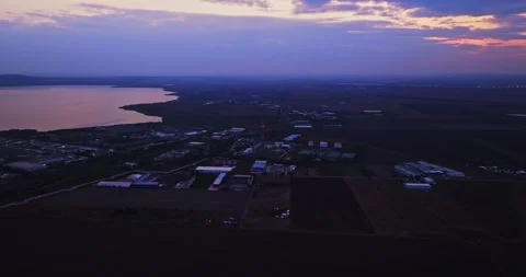 Blue Hour Industrial Structures And Farmland On The Outskirts Of Seaside Town Stock Footage 300447361