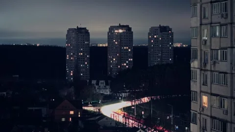 Blue Hour to Night City Time Lapse with Traffic Trails and Apartment Buildings Stock Footage 324920719