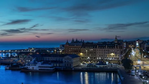 Blue Hour Pan Across Helsingborg Harbor and Town Hall Stock Footage 343759289