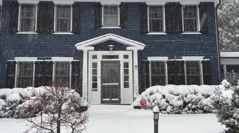 Blue house during snow storm in the United States Suburbs Stock Footage 61863348