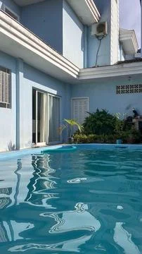 Blue House with Pool in the Backyard Fotos de archivo