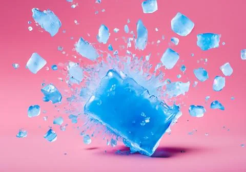 Blue ice block exploding into shards on pink pastel background 写真素材