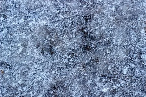Blue ice covered with snow Stock Photos