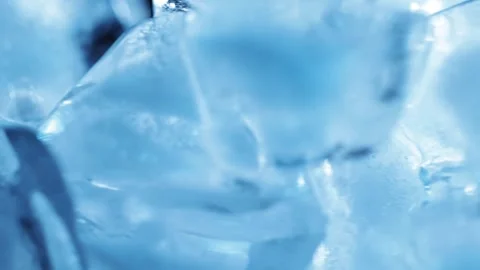 Blue ice cubes rotating at varied speed for drink cooling, refreshing bever.. Stock-Footage 345089878