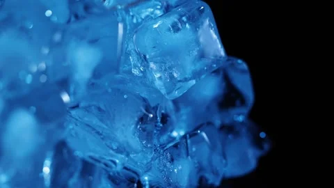 Blue ice cubes slowly rotating and pulling back at the end for cooling drin.. Stock-Footage 344056475