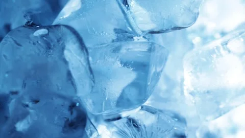 Blue ice cubes slowly rotating and gliding sideways for cooling drink visua.. Stock Footage 345360630