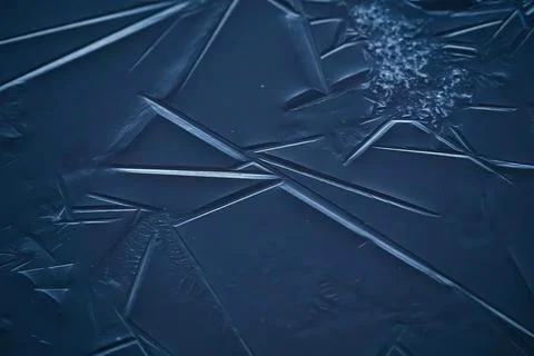 Blue ice patterns, crystallization of frozen water, abstract background Close-up Stock Photos