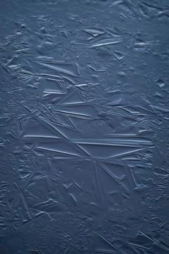 Blue ice patterns, crystallization of frozen water, abstract background Close-up Stock Photos