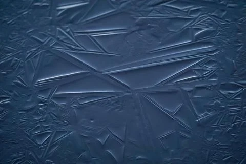 Blue ice patterns, crystallization of frozen water, abstract background Close-up Stock Photos