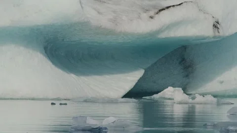 Blue Iceberg Floating in a Glacial Lagoon in Iceland Stock Footage 320514423