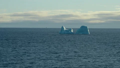Blue iceberg. Iceberg drifting in clear water. Stock Footage 233380962
