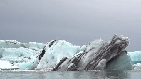 Blue Iceberg steady in the water Stock Footage