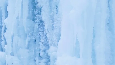 Blue Icy waterfall closeup. Cold icy water in winter. Arctic environment. Video stock 71329313