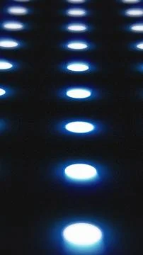 Blue illuminated circles in a grid pattern glowing over a dark surface, creat Stockillustratie