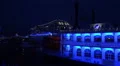 Blue illuminated paddle steamer and cruise ship cruising night HD Footage