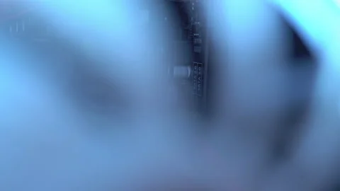 Blue illumination of the fan in the pc case. Blue blades spin to cool computer Stock Footage 161264785