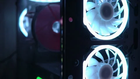 Blue illumination of the fan in the pc case. The gaming pc glows in the dark. Stock Footage 161265235