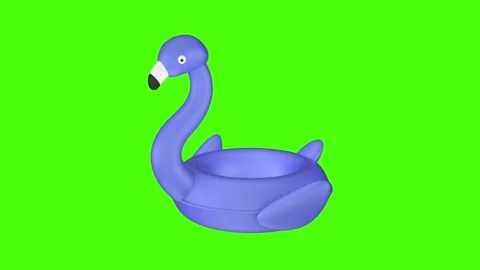 Blue inflatable flamingo pool float pulses and moves closer and farther Stock Footage 332545659
