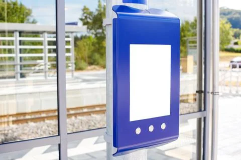 Blue Information Terminal with Blank Screen Mockup at Train Station Stock Photos