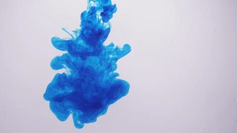 Blue ink cloud billows in front of white background Stock Photos