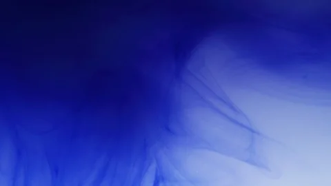 Blue ink diffusing into the water Stock Footage 100021668