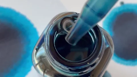 Blue Ink Pot Close up 3 Stock Footage 252019539