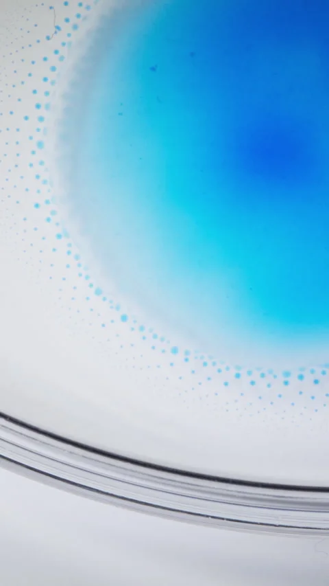 Blue Ink Spreading and Forming Cell-Like Patterns in Liquid Close Up, Vertical Stock Footage 340917193