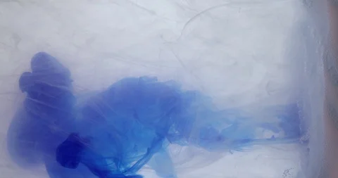 Blue ink within a mixture of white and foamy liquid. Scientific experiment Stock Footage 121430007