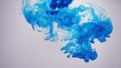 Blue ink/smoke in front of white background Stock Photos